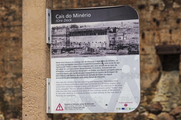 Explanatory board at the ruins of the former ore dock, Mina de Sao Domingos, historic copper open-pit mine, Portugal