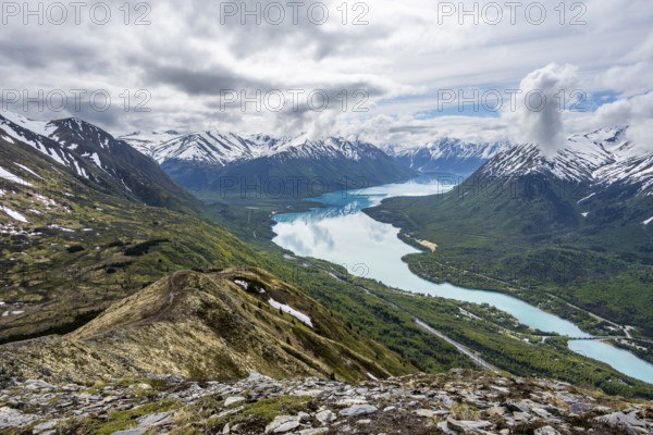 View of snowy mountains and turquoise lake Kenai Lake, Slaughter Ridge Trail, Cooper Landing, Kenai Peninsula, Alaska, USA