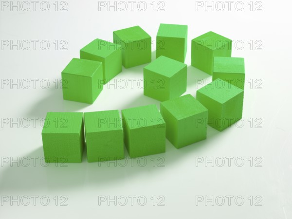 12 green wooden cubes against a white background