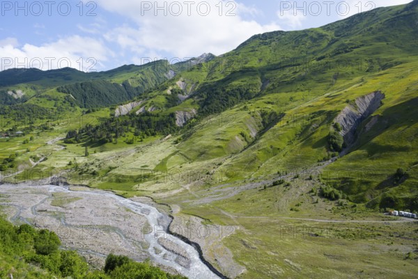 Scrambled landscape with green slopes and small rivers, landscape between Kvesheti and Gudauri, White Aragvi River, Mtskheta-Mtianeti region, Georgian Military Highway, High Caucasus, Georgia