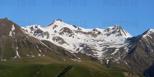 Snowy mountain peaks under a clear blue sky, landscape between Kvesheti and Gudauri, Mtskheta-Mtianeti region, Georgian Military Route, High Caucasus, Georgia