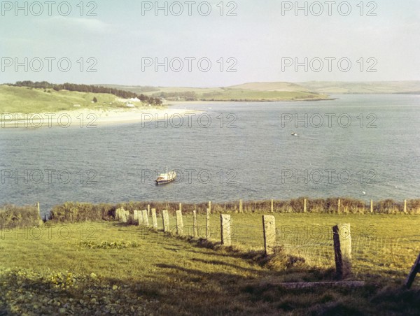 Camel estuary looking over Doom Bar to village of Rock, River Camel, Chiddleypump, near Padstow, Cornwall, England, 1960s