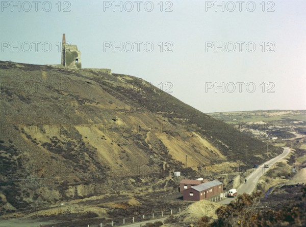 Ruins of engine house building of Tywarnhayle United Mills copper mine, near Porthtowan, St Agnes, Cornwall, England, UK 1960s