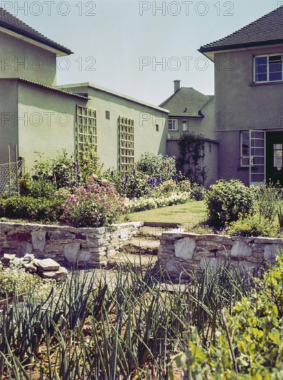 Back garden of suburban house thought to be naval officer housing, possibly Devonport, Plymouth, Devon, England, UK 1960s