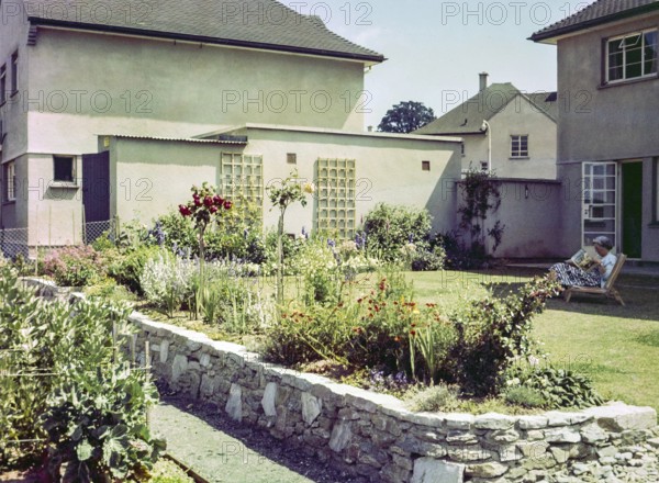 Back garden of suburban house thought to be naval officer housing, possibly Devonport, Plymouth, Devon, England, UK 1960s
