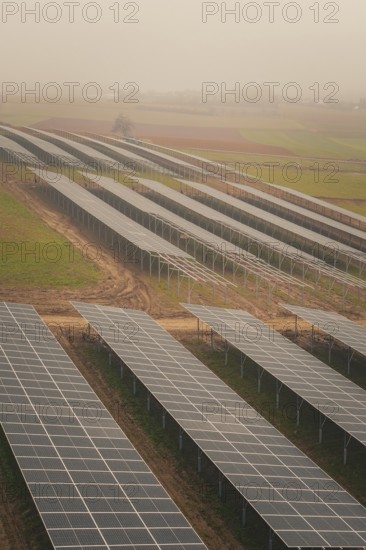Extensive solar systems on green fields, clear lines and structures, energy revolution, construction of PV open space, Baden-Württemberg, Germany