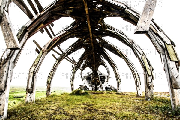 Interior view of an impressive outdoor wooden structure, sculpture by Drakkar Vardø. The Drakkar-Leviathan sculpture was built in summer 2016 by the Taibola Assemble team from Archangelsk Severodvinsk, Vardø, Finnmark, Norway