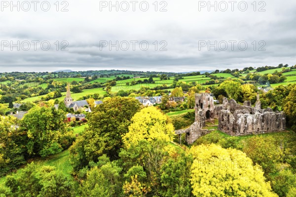Autumn Colours over ruins of Grosmont Castle from a drone, Grosmont, Monmouthshire, Wales, UK