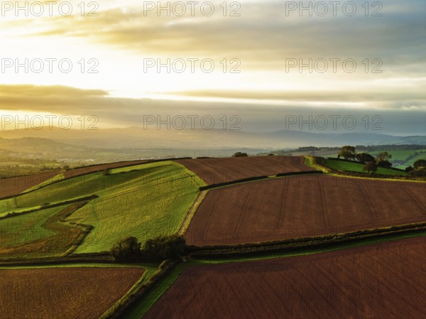 Colours of autumn Fields and Farms over Sheldon from a drone, Torbay, Devon, England, United Kingdom