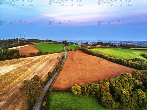 Sunset of Devon Farms and Fields over Berry Pomeroy from a drone, Totnes, England, United Kingdom