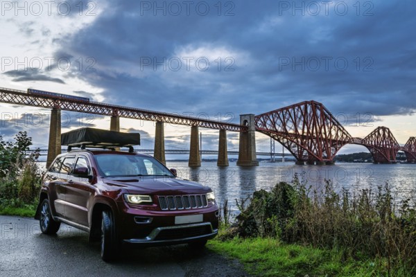 4x4 car trip with roof tent in Forth Bridge, Queensferry Crossing, Forth Estuary, Scotland, United Kingdom