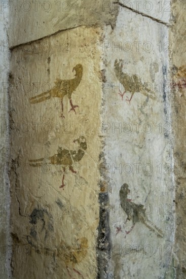 Mazerier village. Murals of painted church St. Saturninus, The pheasant hunting. Allier department, Auvergne Rhone Alpes, France