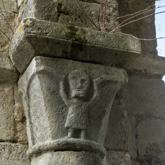 St Cyr and St Julitte's Church, roman church of Escurolles. Atlas sculpture. Allier department, Auvergne Rhone Alpes, France