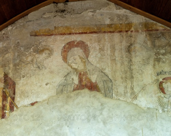 The Annunciation. Painted church St Aignan's, Church of Begues. Allier department. Auvergne Rhone Alpes. France