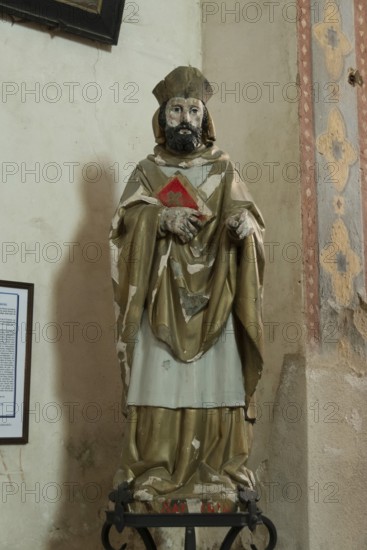 Saint Saturnin statue. Mazerier painted church. St Saturninus Church. Allier department, Auvergne Rhone Alpes, France