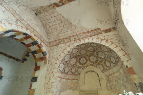 Wall paintings. Painted church St Aignan's Church of Begues. Allier department. Auvergne Rhone Alpes. France. Europe