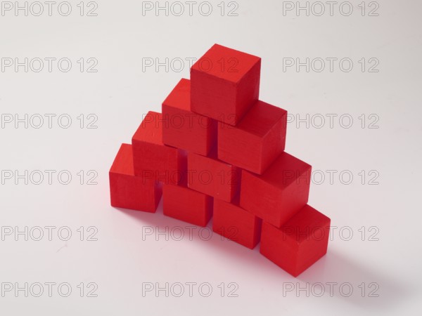 10 red wooden cubes against a white background