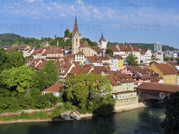 View of the old town with the parish church of the Assumption of Mary, in the back the Baden City Tower, on the right the covered wooden bridge that crosses the Limmat River, Baden, Canton, Aargau, Switzerland