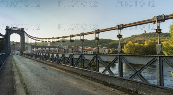 Suspension bridge of Coudes village on river Allier. Puy de Dome. Auvergne Rhone Alpes. France