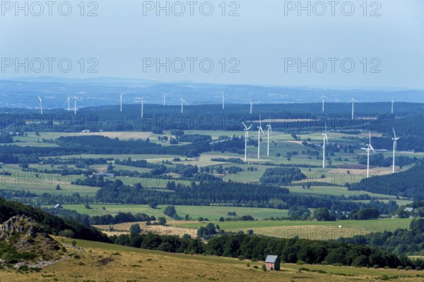 Wind turbines of Combrailles plateau near Bourg-Lastic. Puy de Dome. Auvergne Rhone Alpes. France