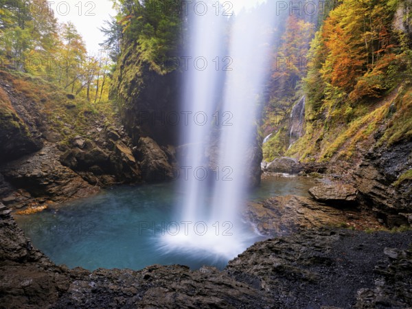 Waterfall mountain list in autumn-colored surroundings, Linthal, Klausenpass, Canton of Glarus, Switzerland