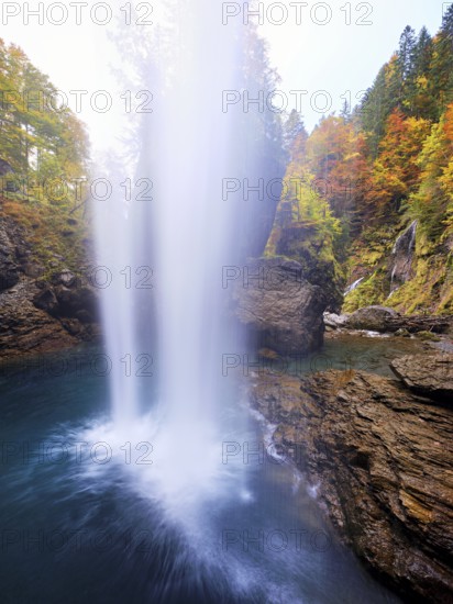 Waterfall mountain list in autumn-colored surroundings, Linthal, Klausenpass, Canton of Glarus, Switzerland