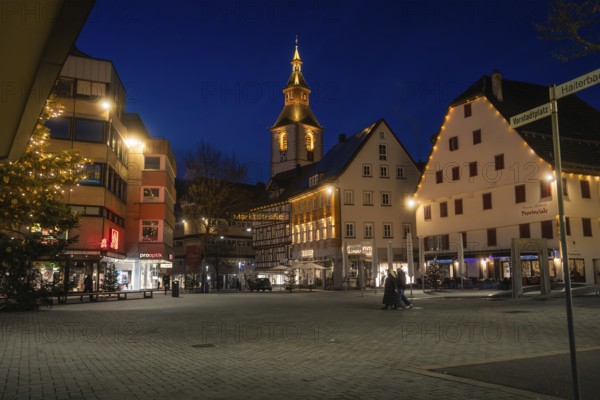 Urban square at night with illuminated half-timbered houses and church tower, Nagold, Calw district, Black Forest, Germany