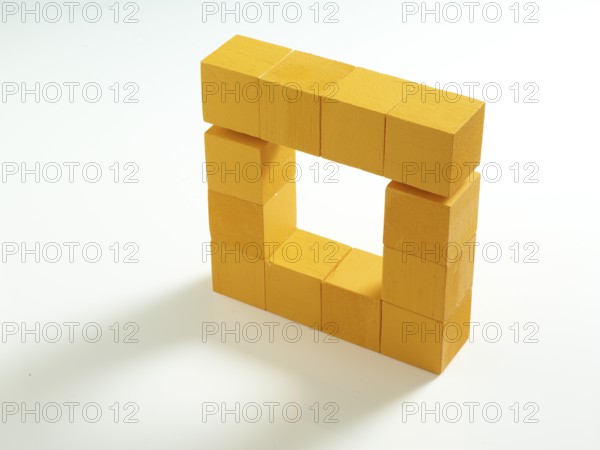 12 yellow wooden cubes against a white background