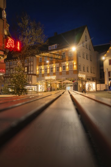 Night scene with illuminated shops and Christmas decorations in a shopping street, Nagold, Calw district, Black Forest, Germany