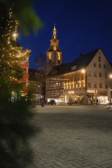 Illuminated house facades in the city center decorated with Christmas lights in the evening, Nagold, Calw district, Black Forest, Germany