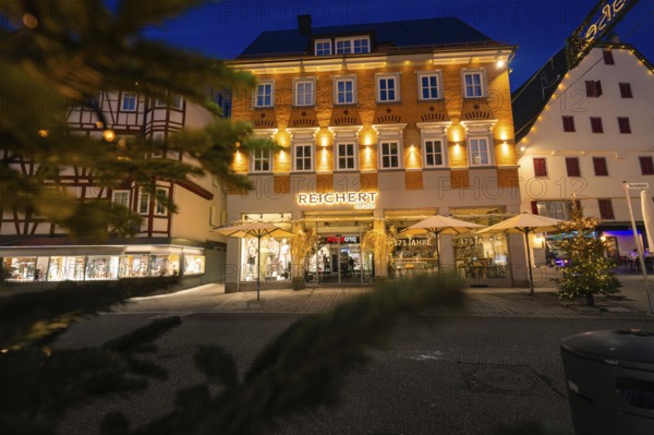 Illuminated facades of a building with Christmas decoration in the city, Nagold, Calw district, Black Forest, Germany