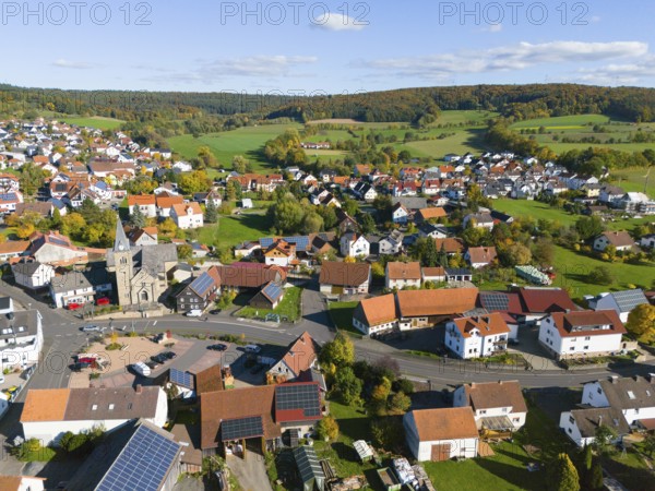 Bird's-eye view of village with many houses in hilly landscape, aerial view, Niederkalbach, Kalbach municipality, Fulda district, Hessian Rhön nature park Park, Hesse, Germany