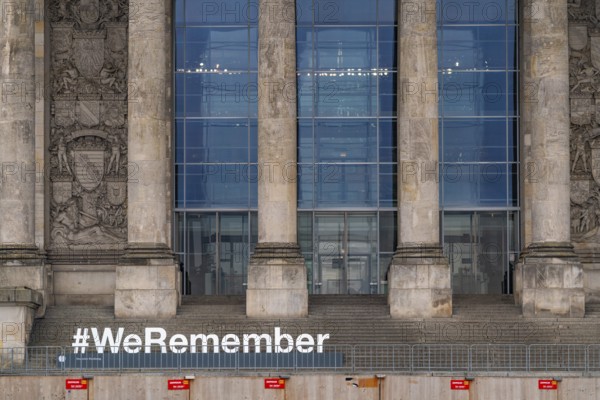Construction fences and letters with the hashtag We Remember in memory of the victims of fascism and National Socialism in front of the German Bundestag in the Reichstag, Platz der Republik, Berlin, Germany