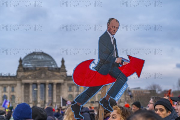 Photo of Federal Chancellor Friedrich Merz on the AfD arrow logo, demonstration against the right and for the preservation of the firewall on February 2, 2025, Republic Square in front of the Reichstag, Berlin, Germany