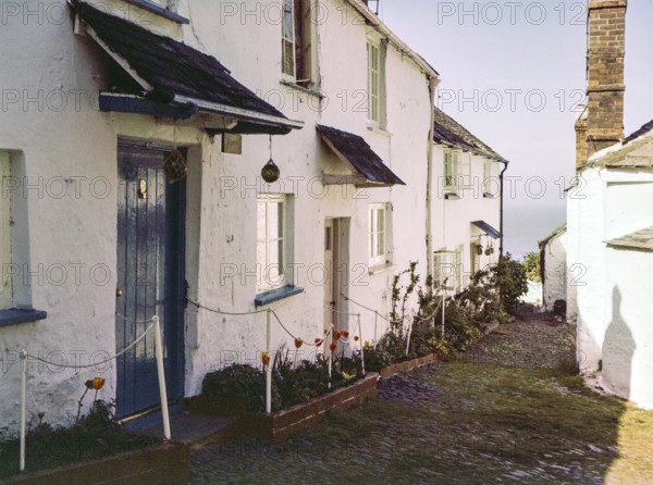 Historic building soon cobbled street in coastal village of Clovelly, north Devon, England, UK 1960s