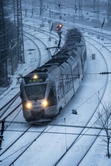 Winter weather, snowfall, VIAS regional express, regional traffic, on the route east, in front of Essen main station, regional transport North Rhine-Westphalia, Germany