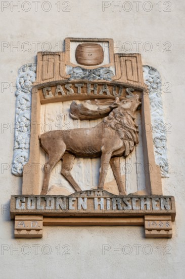 Relief of the Gasthaus Zum Goldenen Hirschen on a house façade, Fürth, Middle Franconia, Bavaria, Germany