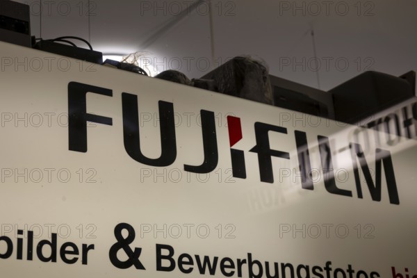 Close-up of the FUJIFILM logo at a photo shop