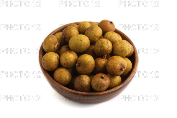 Ripe Longan in wooden bowl isolated on white background, side view, close up, minimalism