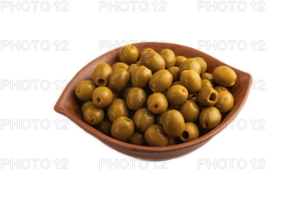 Fresh green olives in ceramic clay isolated on white background. side view, close up
