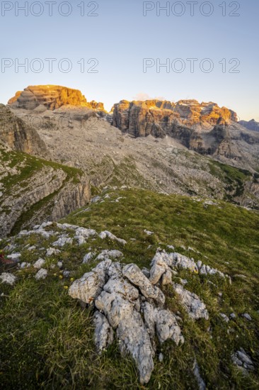 View of rocky mountain peaks of the Brenta Mountains at sunset, Alpenglühen, mountain landscape on the Grosté Plateau, Brenta, Parco Naturale Brenta-Adamello, Trentino, Italy