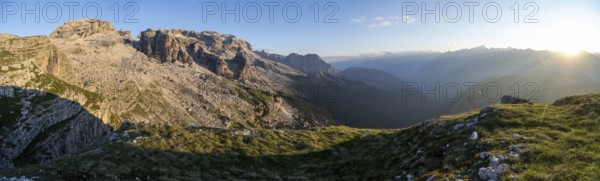 Panorama, view of rocky mountain peaks of the Brenta Mountains in the evening light, sunset over the Adamello Group, mountain landscape on the Grosté Plateau, Brenta-Adamello Natural Park, Trentino, Italy