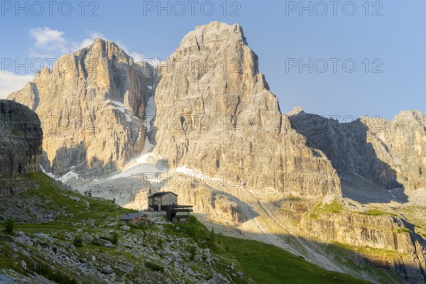 Picturesque mountain landscape in the morning, Rifugio Ai Brentei mountain hut and Cima Tosa rock peak, Brenta, Trentino, Italy