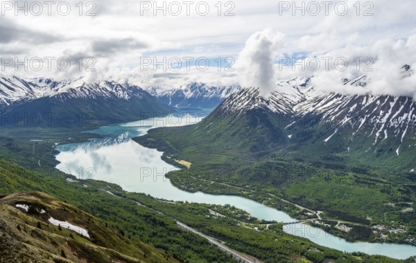 View of snowy mountains and turquoise lake Kenai Lake, Slaughter Ridge Trail, Cooper Landing, Kenai Peninsula, Alaska, USA
