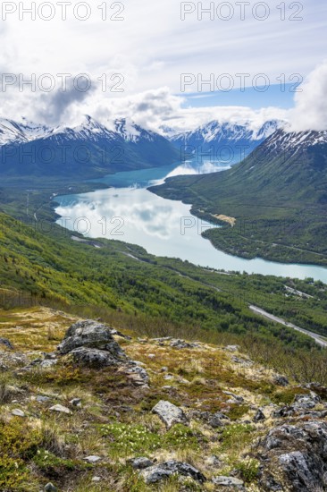 View of snowy mountains and turquoise lake Kenai Lake, Slaughter Ridge Trail, Cooper Landing, Kenai Peninsula, Alaska, USA