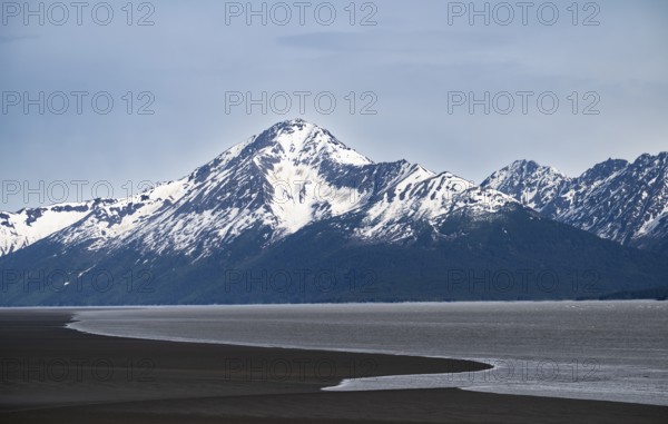 View of the Turnagain Arm estuary at low tide to the mountains of the Kenai Peninsula, Anchorage, Alaska, USA