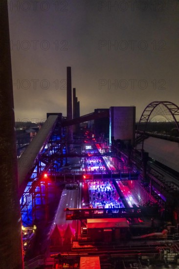 Ice rink at the Zollverein coking plant, ice skating with music and many lighting effects, Essen, North Rhine-Westphalia, Germany