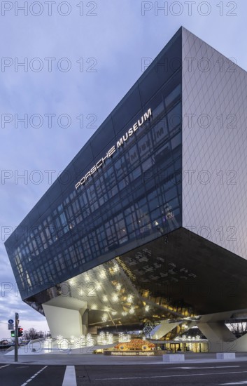 Highlights on Porscheplatz in Zuffenhausen. In front of the Porsche Museum and the car manufacturer's headquarters, a 911 sports car shines in Christmassy splendor. Stuttgart, Baden-Württemberg, Germany