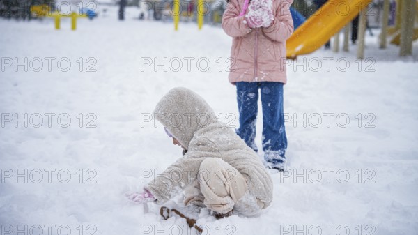 In Gaziantep, Turkey, on December 31, 2025, children and families enjoy winter activities as they play on snow-covered areas and slide on icy hills, creating a lively atmosphere across the city during the final day of the year, Gaziantep, Gaziantep, Turkey
