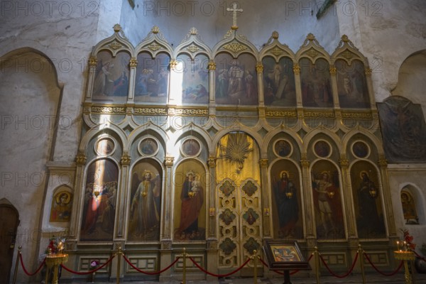 Church interior with magnificent icon wall decorated with religious paintings and golden details, Ananuri Castle, Zhinvali Reservoir, Jinvali or Shinvali, Mtskheta-Mtianeti Region, Georgian Military Highway, Georgia